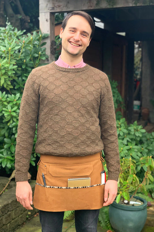 full picture of the front of a person wearing dogwood apron