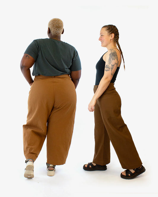 picture of two people wearing both views of falconer pants from the back and from the side