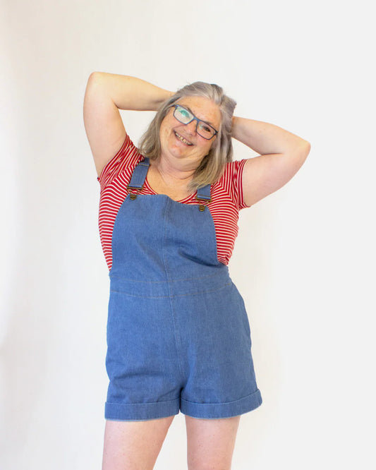 picture from the front of person wearing shorts overalls
