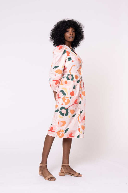 Woman wearing a floral dress on a white background