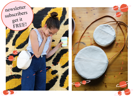 Woman holding a take-out coffee cup against a colorful wall with white fabric circular handbag with leather strap worn across her body. The second image is the circular handbag both large and small  on a wooden surface.