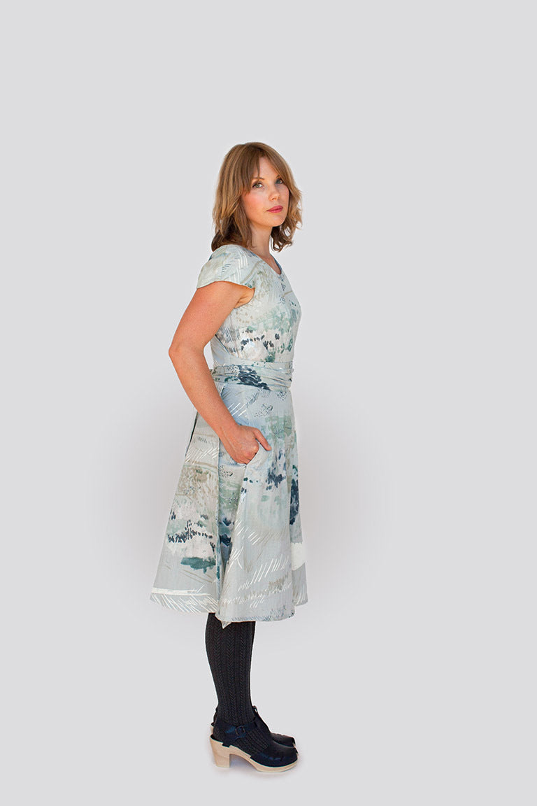 Woman wearing a floral dress on a white background