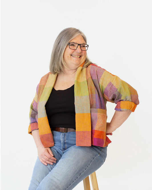 picture of person wearing a plaid moss jacket short view