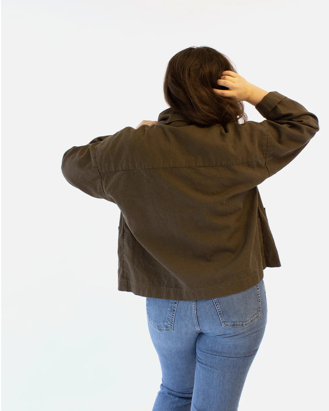 picture from the back of person wearing a moss jacket short view