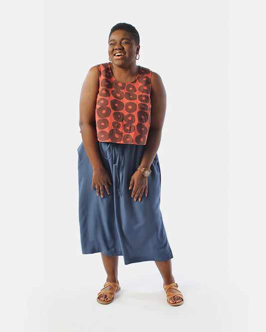 Person wearing Ashton top and skirt full against white backdrop