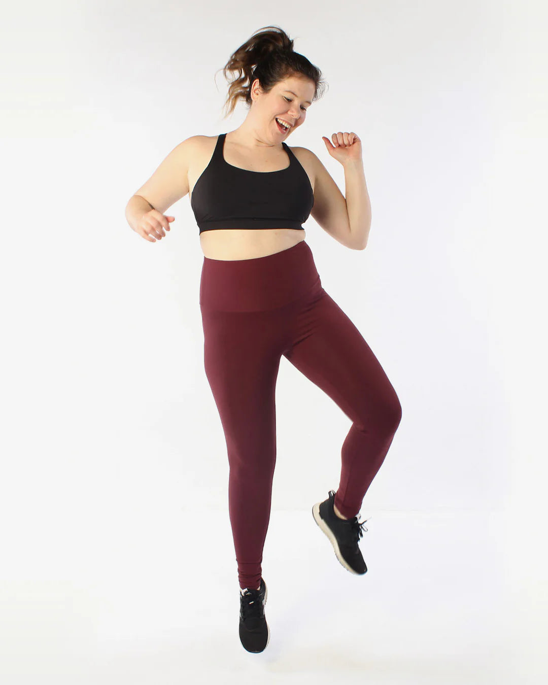 Full picture of avery leggings product with model jumping up