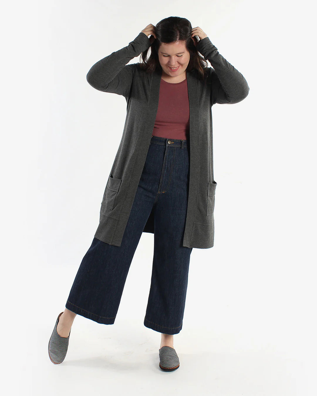 full picture of person wearing a dark gray blackwood cardigan in view a