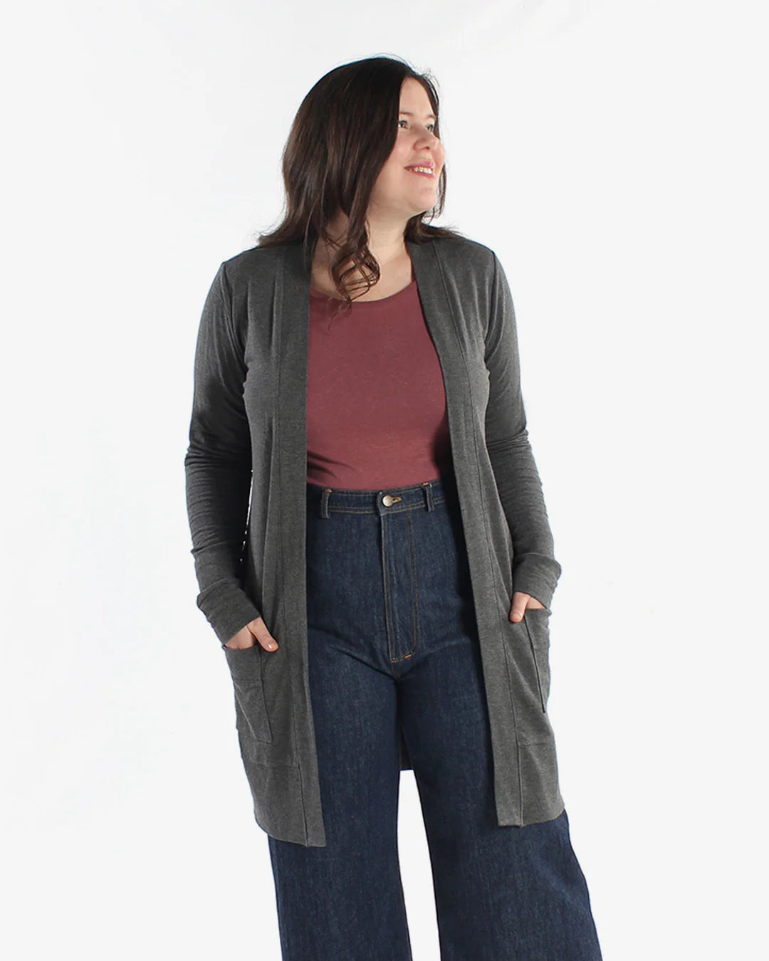 detail picture of person with her hands in the pockets wearing a dark gray blackwood cardigan in view a