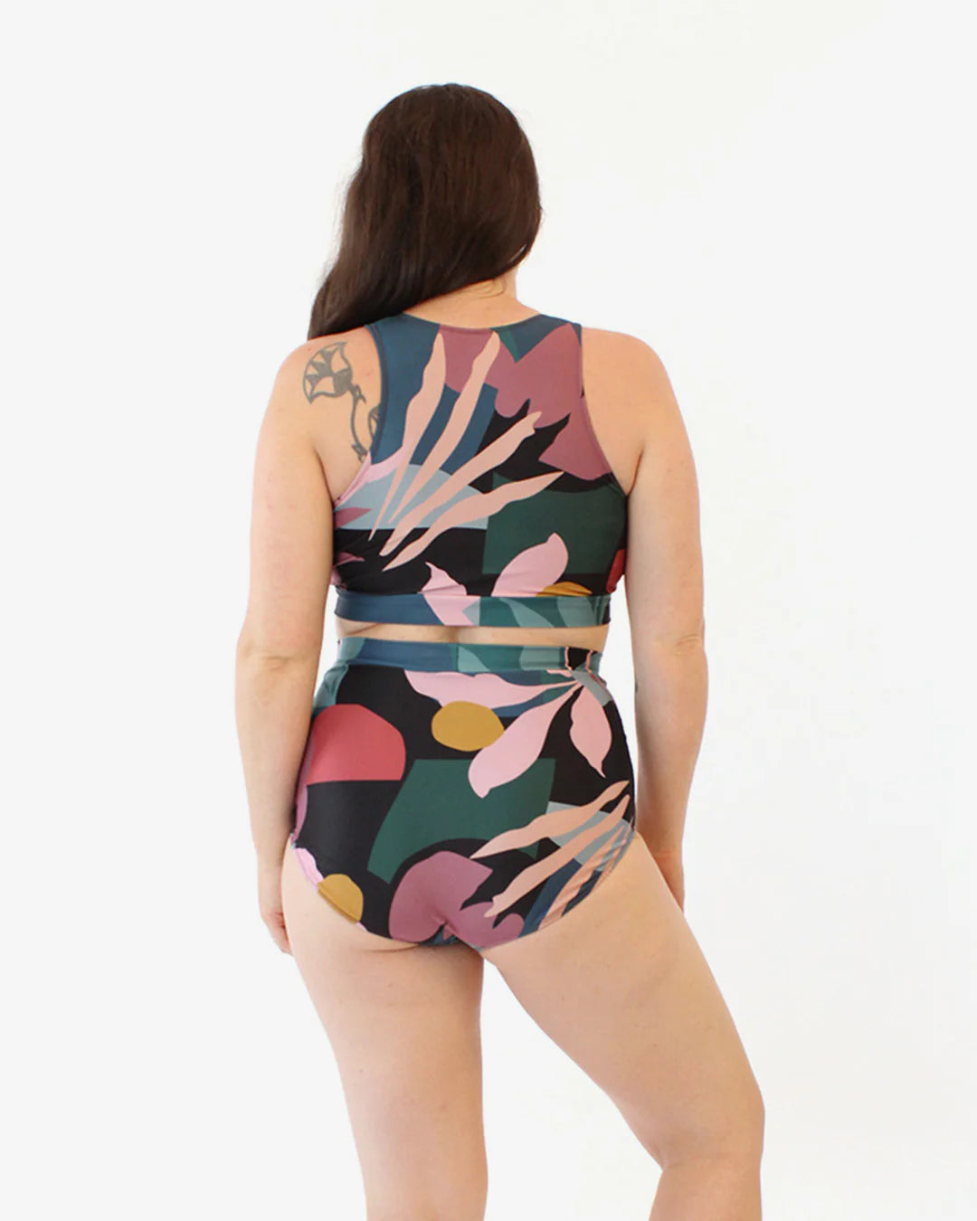 picture from back of person wearing tank top and brief bottoms of swim suit