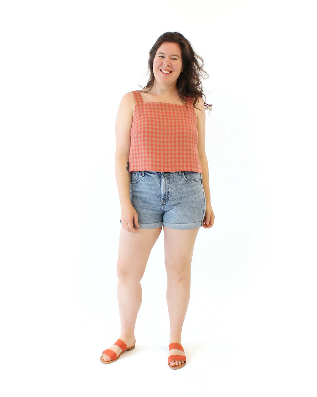 picture of person wearing orange print top of the reynolds dress