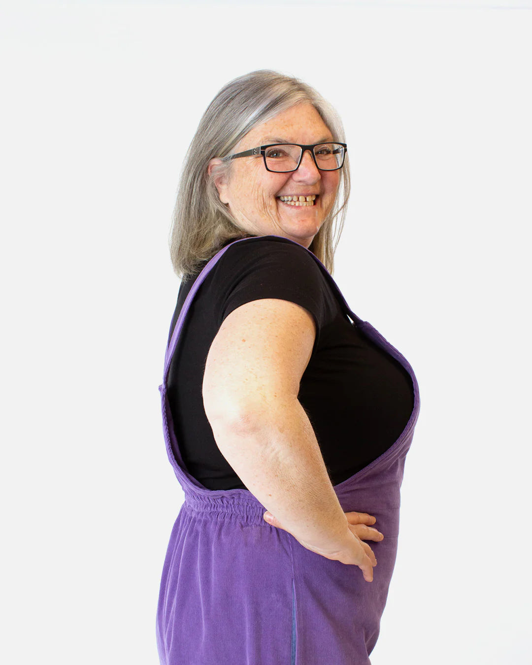picture from the side of person wearing overalls with elastic waistband