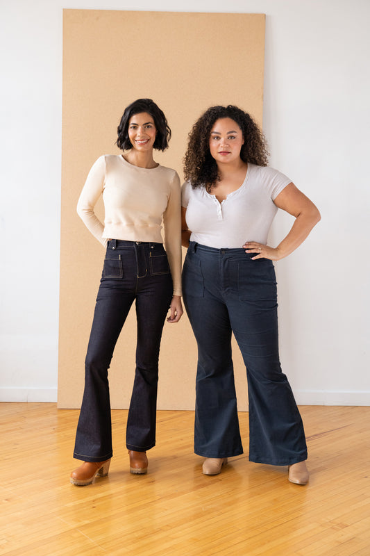 two women wearing flared jeans made from the same sewing pattern