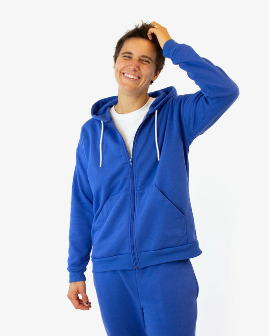 picture from the front of person wearing blue zippered hoodie