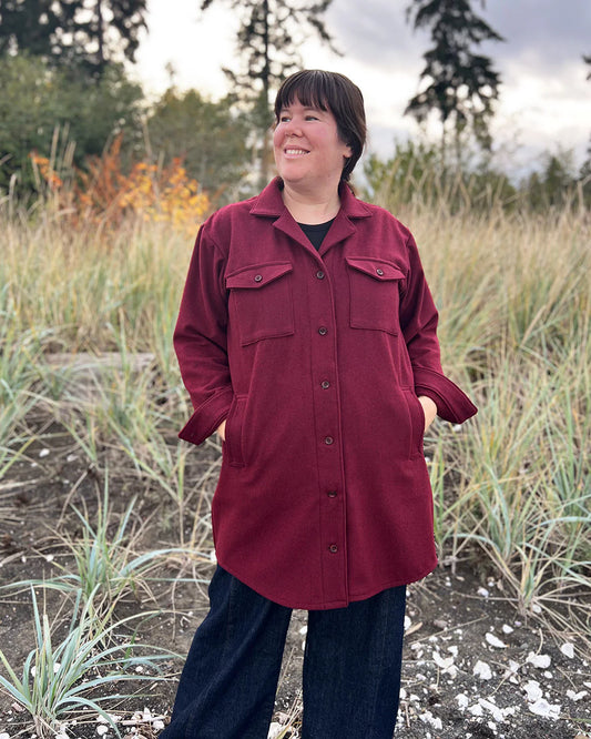 picture of a woman standing outside wearing a burgundy shacket