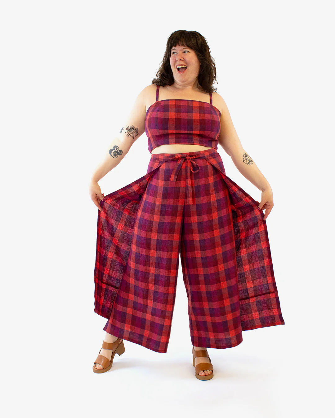 picture of woman wearing red plaid wrapped culottes.