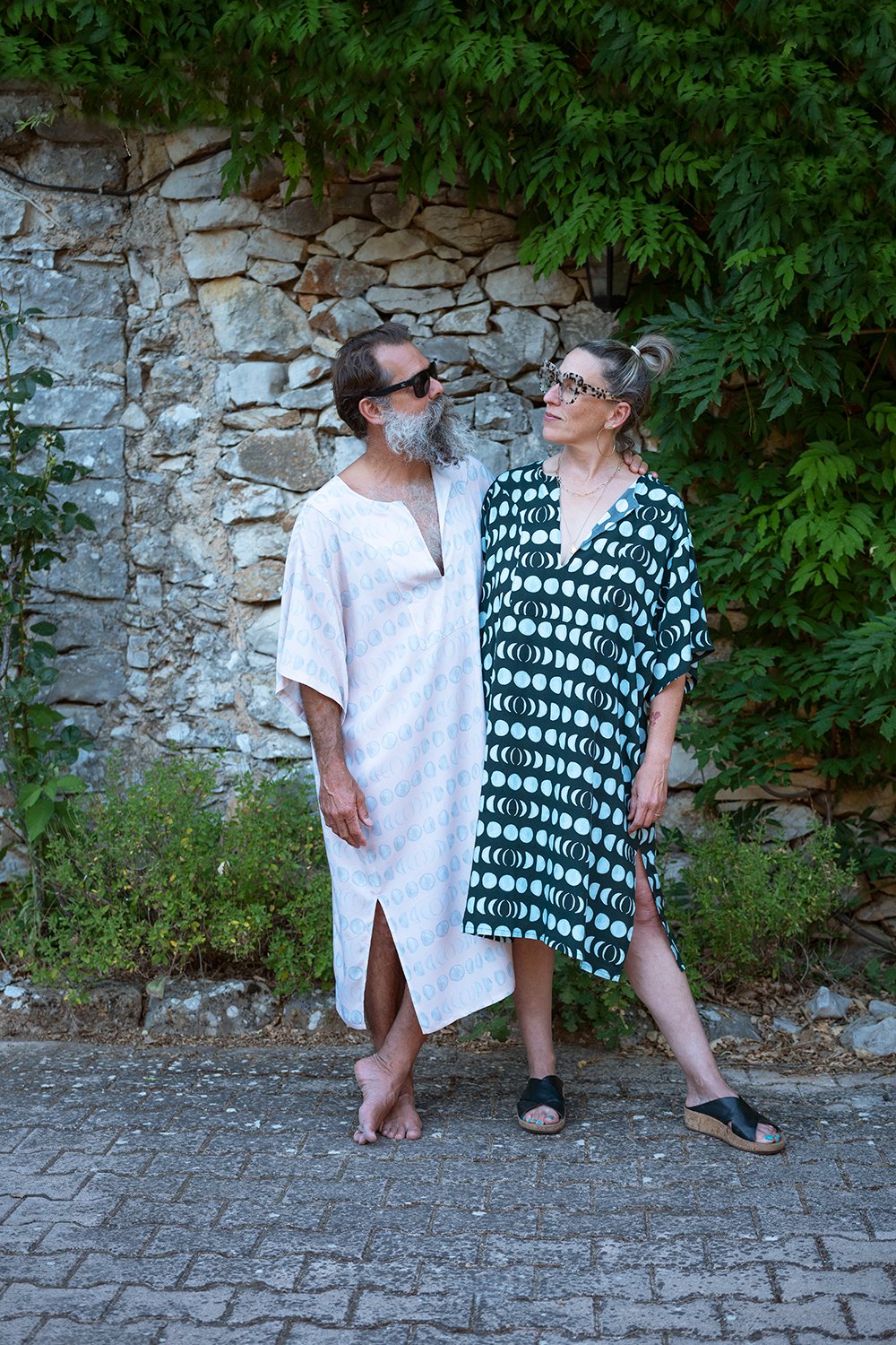 a man and a woman wearing comfy tunics